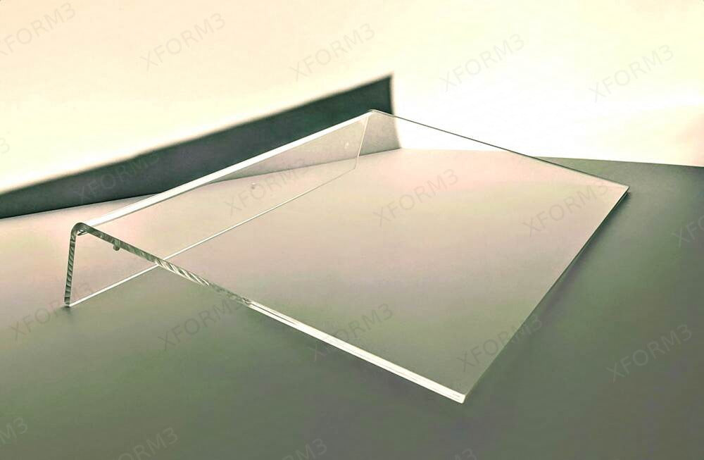 Clear acrylic shelf shown from above with its formed rear lip