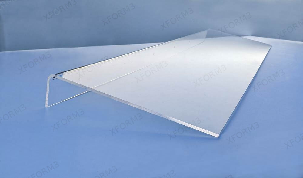 Long clear acrylic shelf showing its polished edge and single-piece mounting lip